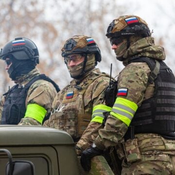 Russian Assault Military Soldiers Standing In The Back Of a Truck