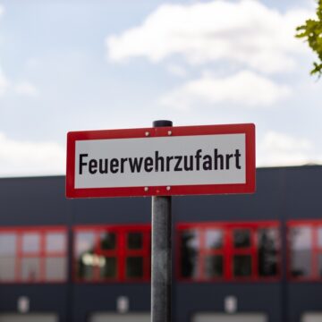 Feuerwehrzufahrt Sign (Fire Brigade Access Road) In Front Of An Industrial Building In Germany