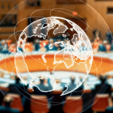 Concept Image Of World Leader Round Table With Glass Globe Overlay