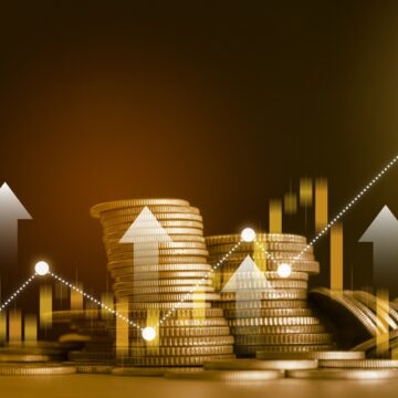 Concept Image Of Stacks Of Coins, Up Arrows, And Rising Graph