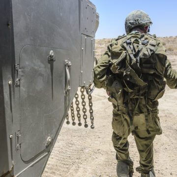 Israel Army Combat Soldier Exiting A Tank During Military Training