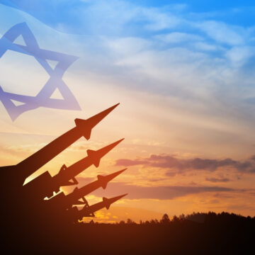 Composite Image Of Missile Silhouettes Against A Sunset And And The Flag Of Israel