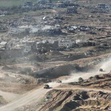 Drone View Of IDF Hummer Jeep Driving In Decimated Northern Gaza