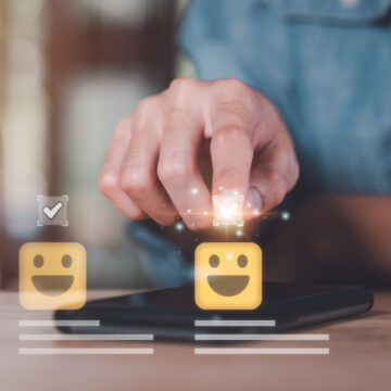 A Man's Hand Pushing Happy Face Button