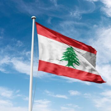 Republic Of Lebanon Flag Waving With Cloudy, Blue Sky In Background