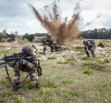 Squad Of French Infantry Soldiers Amid Explosions On The Ground