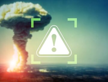 Threat,Of,Nuclear,Attack.,Warning,Icon. Concept Image Of Nuclear Mushroom Cloud And Warning Icon