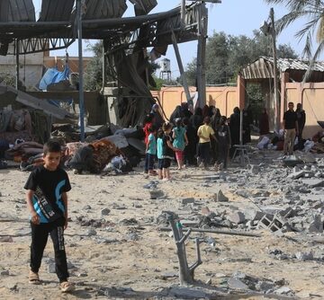 Palestinians Inspect A House After An Israeli Air Strike