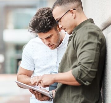 Two Young Men Reviewing Information