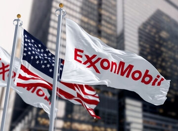 The U.S. Flag Flying Between Two ExxonMobil Flags