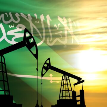 Silhouette Of Oil Pumps On Background Of Saudi Flag