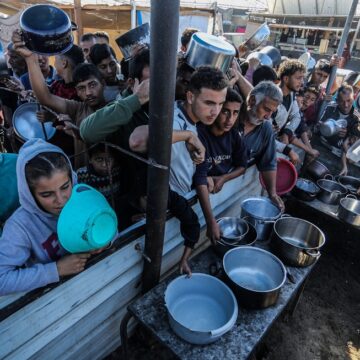 Displaced Palestinians Line Up For Meals From Rafah Charity Kitchen In Khan Yunis