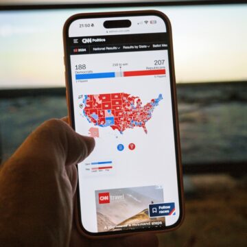 A Smartphone Screen Displays The U.S. Electoral Map