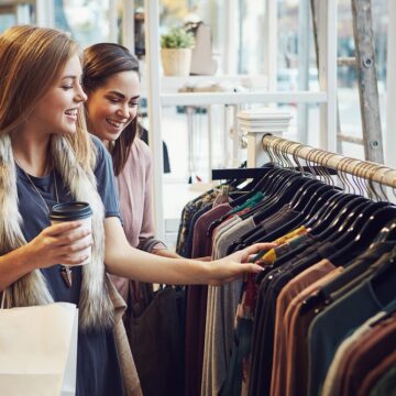 Two Young Women Fashion Shopping For Clothes