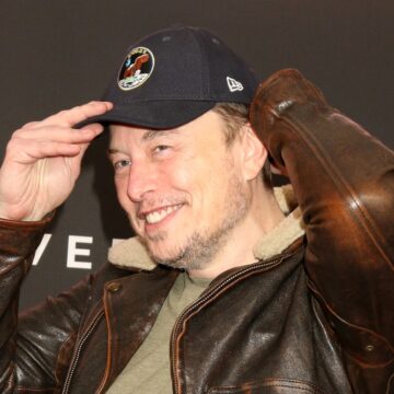 A Smiling Elon Musk Dons A Cap In Los Angeles, CA
