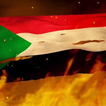 The Flag Of Sudan Going Up In Flames