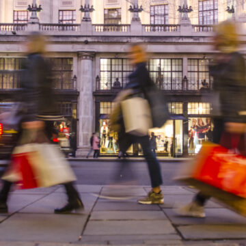 Group Of Female Shoppers Carrying Many Shopping Bags On Streets Of London