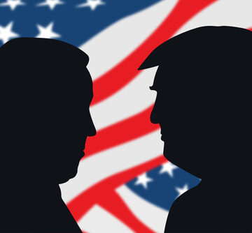 Profile Silhouettes Of Joe Biden Facing Donald Trump With The U.S. Flag In The Background