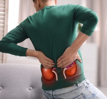 Man Holding His Back Suffering From Kidney Pain