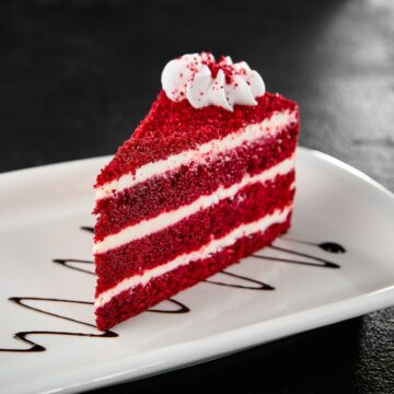 Delicious Slice Of Red Velvet Cake On A White Plate