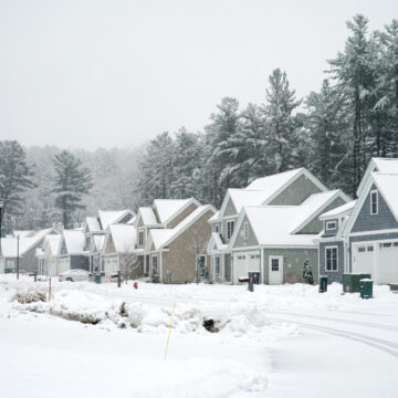 A Row Of Houses In A Residential Community After A Snow Storm