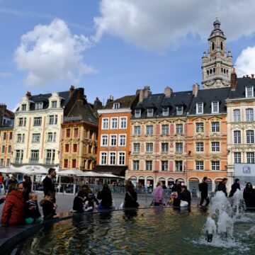 Tourists,Walk,In,Street,Of,Lille,,France,On,April,9, Tourists Walk In The Streets Of Lille, France