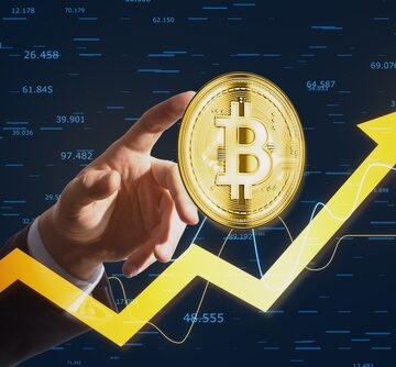 Close-Up Of Hand Pointing At Golden Bitcoin And Upward Yellow Arrow