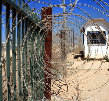 Barbed Wire On A Fence Alongside A Border Checkpoint In Israel
