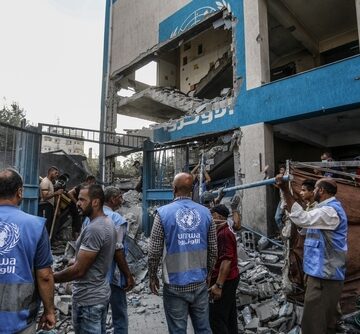 Palestinians,At,The,Site,Of,An,Israeli,Airstrike,At,An Palestinians At The Site Of An Israeli Airstrike At An UNRWA Site