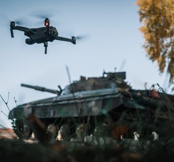 A Drone Flying Above A Tank