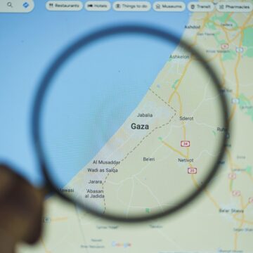 A Map Of The Gaza Strip Viewed Through A Magnifying Glass