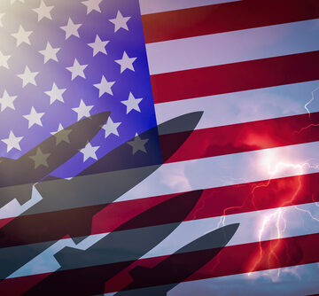 Silhouette Of Missiles Against The Background Of The American Flag