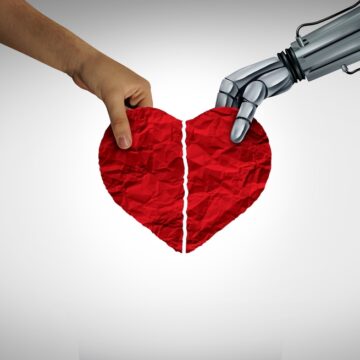 Concept Image Of AI Dating With Human Hand And Robotic Hand Holding A Broken Heart