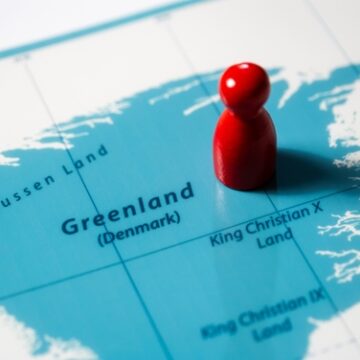 A Map Of Greenland With A Red Chess Piece On It