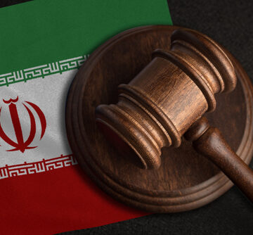 A Gavel And Flag Of Iran