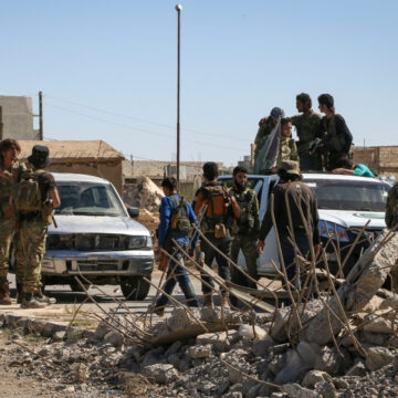 Syrian Soldiers Gather At A Checkpoint Near Aleppo