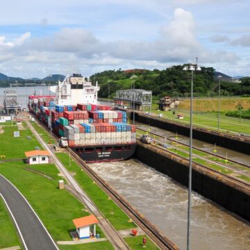 A Cargo Ship Going Through The Panama Canal