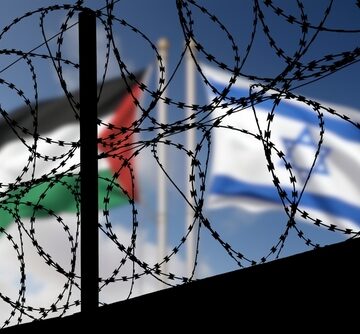 Flags Of Israel And Palestine Behind Barbed Wire