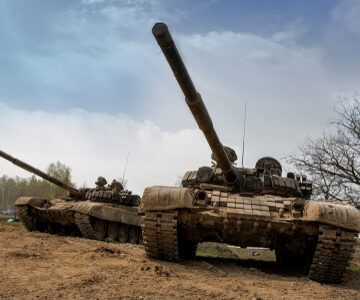 Army Tanks Coming Over Hill