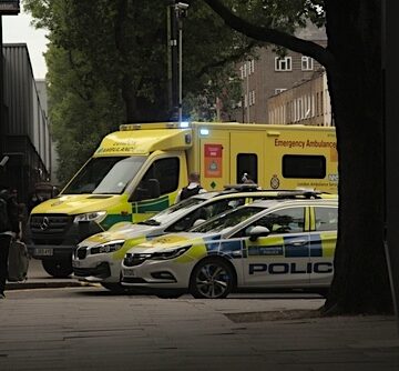 London Ambulance Service & Metropolitan Police At A Scene In London