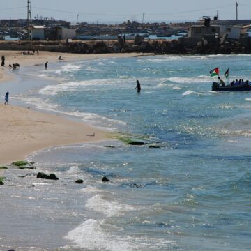Palestinians,Walk,On,A,Beautiful,Beach.,Children,Play,On,The Palestinians Walk On A Beach in Gaza City, Gaza