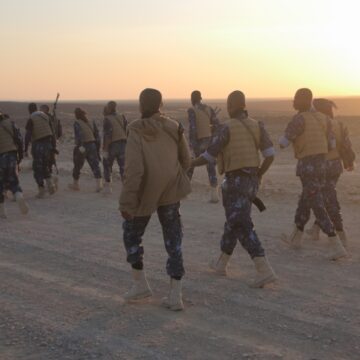 Houthi Rebels Walking On A Sandy Road