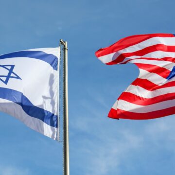 The American And Israeli Flags Waving In The Wind