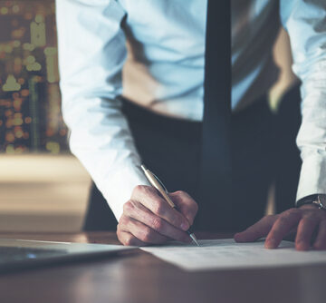 Close Up Of A Business Man Signing A Contract, Making A Deal