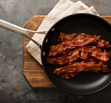 Cooked,Sizzling,Hot,Tasty,Crispy,Bacon,On,A,Skillet,Ready SYNTHETIC DEVOLUTION: CRISPR BACON