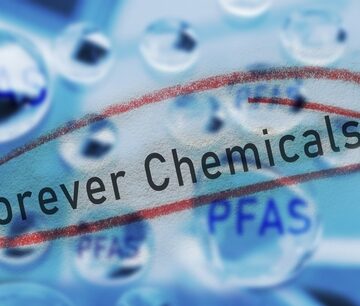 The Words "Forever Chemicals" Circled With Water Drops With PFAS Text In The Background