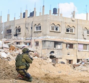 An IDF Soldier Near The Destroyed Palestinian City Of Khan Yunis
