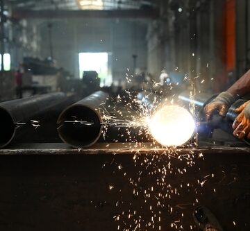 Photo Of Factory Workers Welding Steel