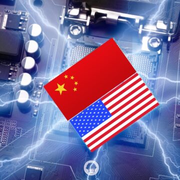 The Chinese And U.S. Flags Over A Large Image Of A Computer Chip