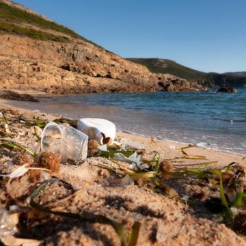 Close Up Of Plastic Pollution On A Sandy Beach